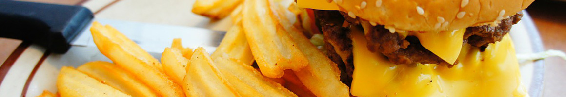 Eating Burger Food Stand at THE BELLEMONT SHAKE SHOP restaurant in Natchez, MS.